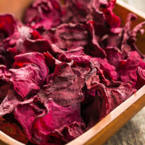 Dried beetroot chips in bowl.