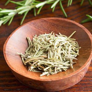 Dry herb served in wooden plate, rosemary