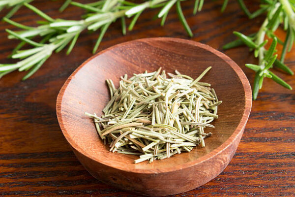 Dry herb served in wooden plate, rosemary